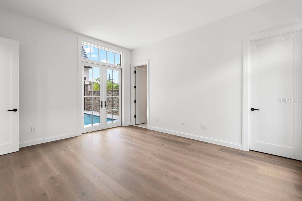 10335 WINTER SPARKLE CIRCLE, Golden Oak, FL 32836 First-floor guest suite with en-suite bath and access to outdoor courtyard