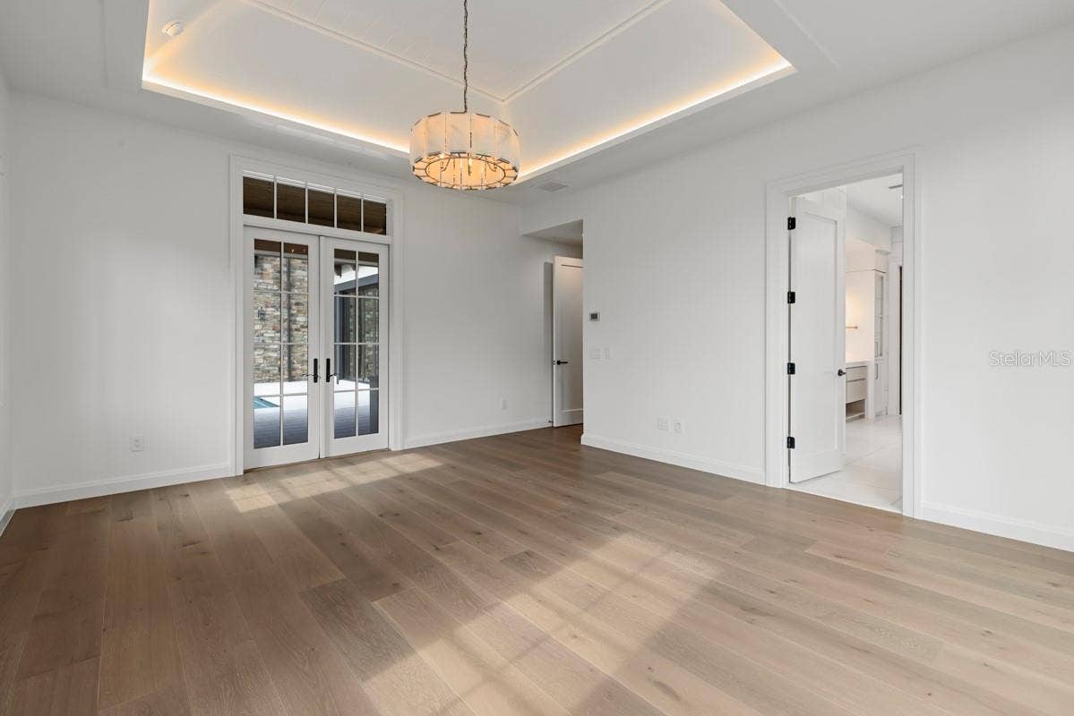 10335 WINTER SPARKLE CIRCLE, Golden Oak, FL 32836 Luxurious primary bedroom with access to outdoor courtyard