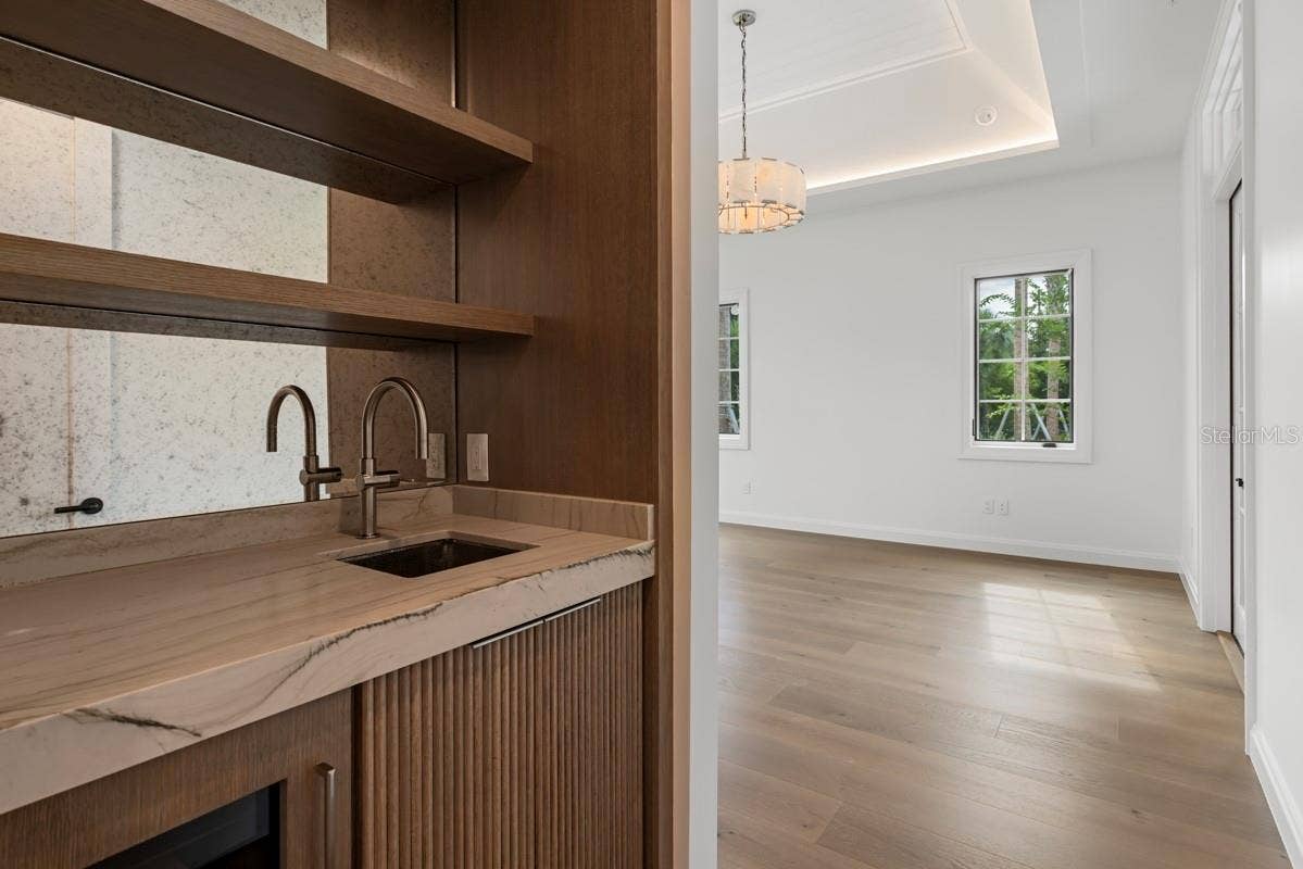 10335 WINTER SPARKLE CIRCLE, Golden Oak, FL 32836 Luxurious primary bedroom suite with morning bar