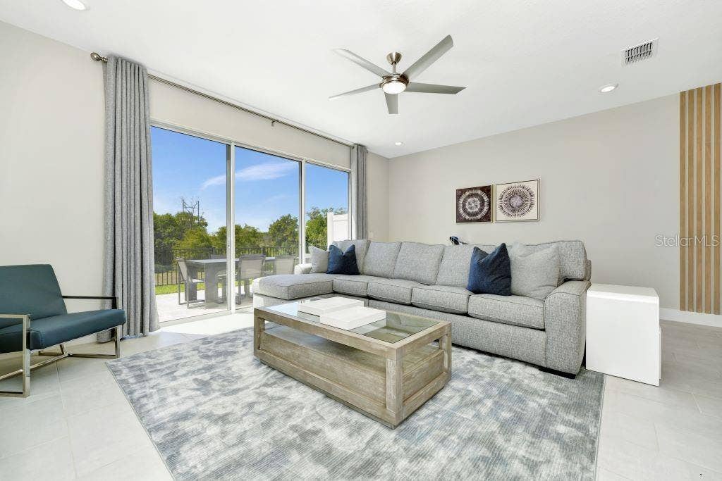 7917 NW SPECTRUM DRIVE, Kissimmee, FL 34747 Living Room 2
