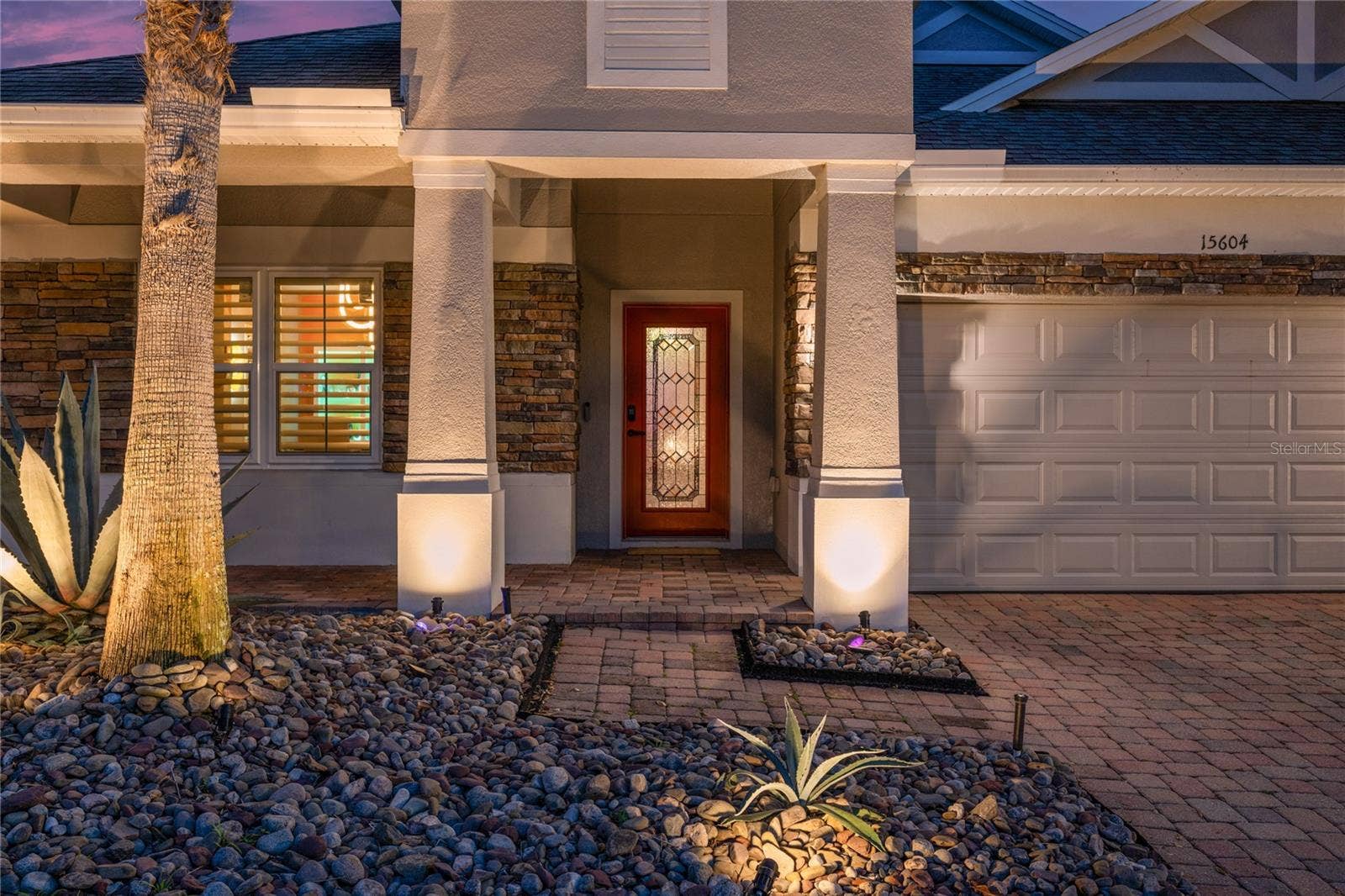 15604 GRANLUND STREET, Winter Garden, FL 34787 Stacked stone facade and rock landscape beds.
