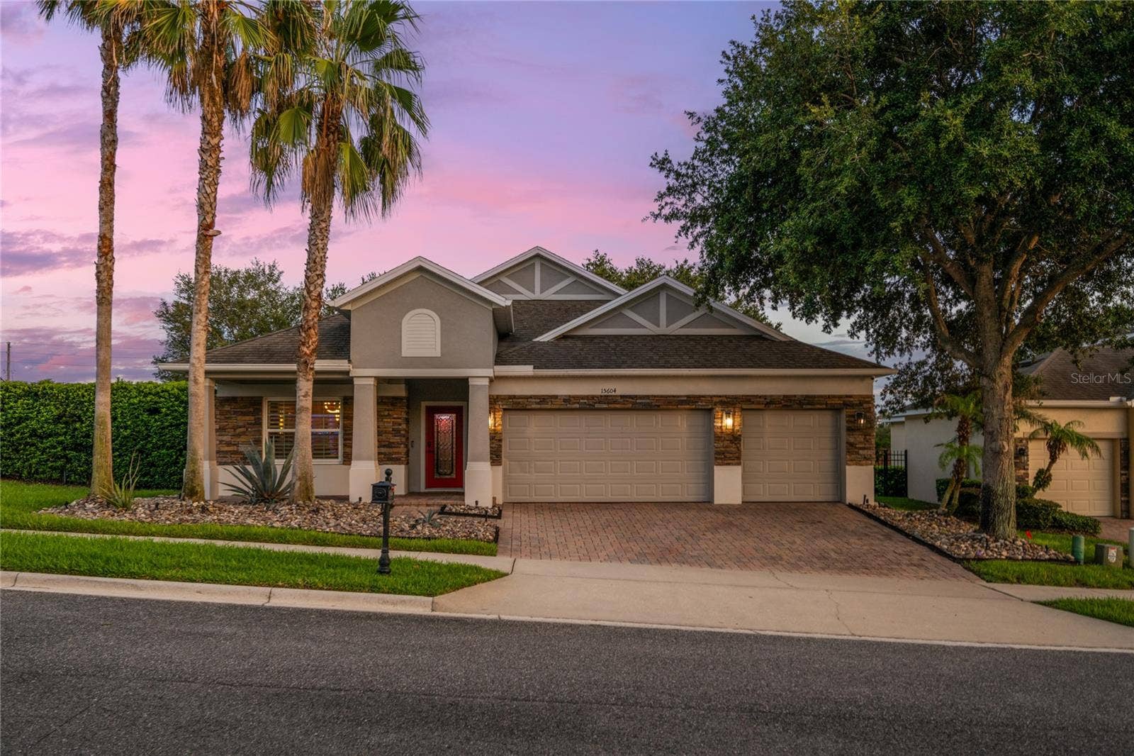 15604 GRANLUND STREET, Winter Garden, FL 34787 Great curb appeal, 3 car garage and paver driveway.