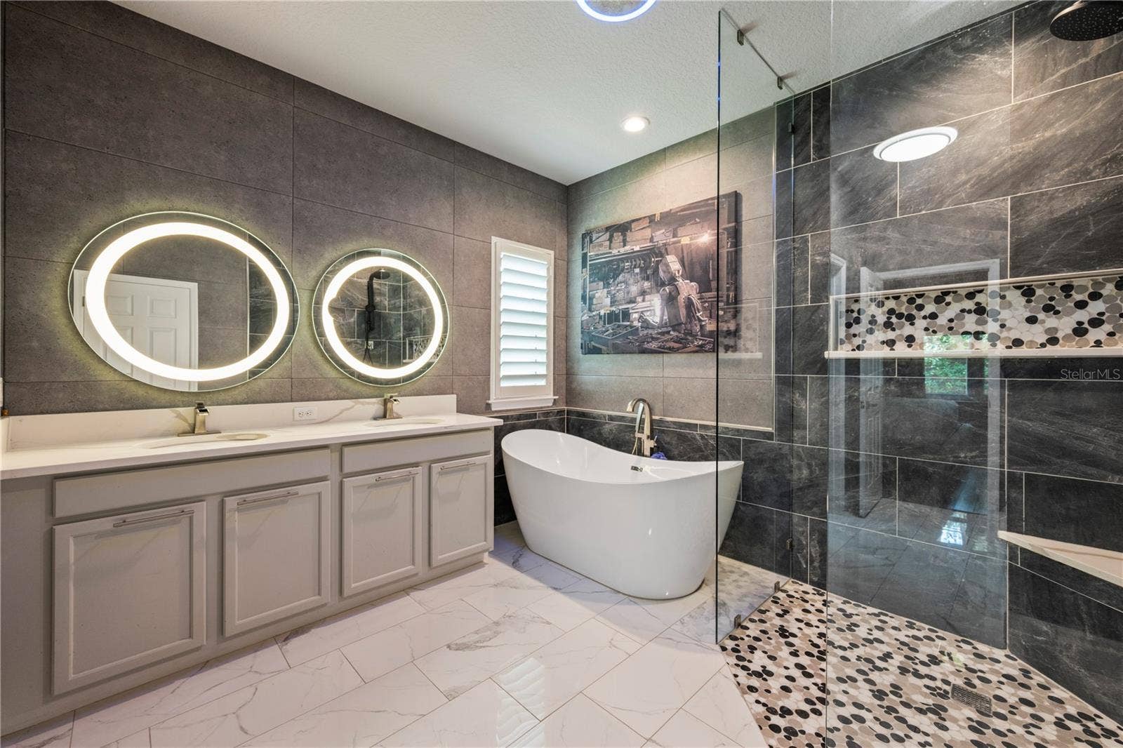 15604 GRANLUND STREET, Winter Garden, FL 34787 Beautiful Primary Bath with frameless shower, soaking tub and dual vanity.
