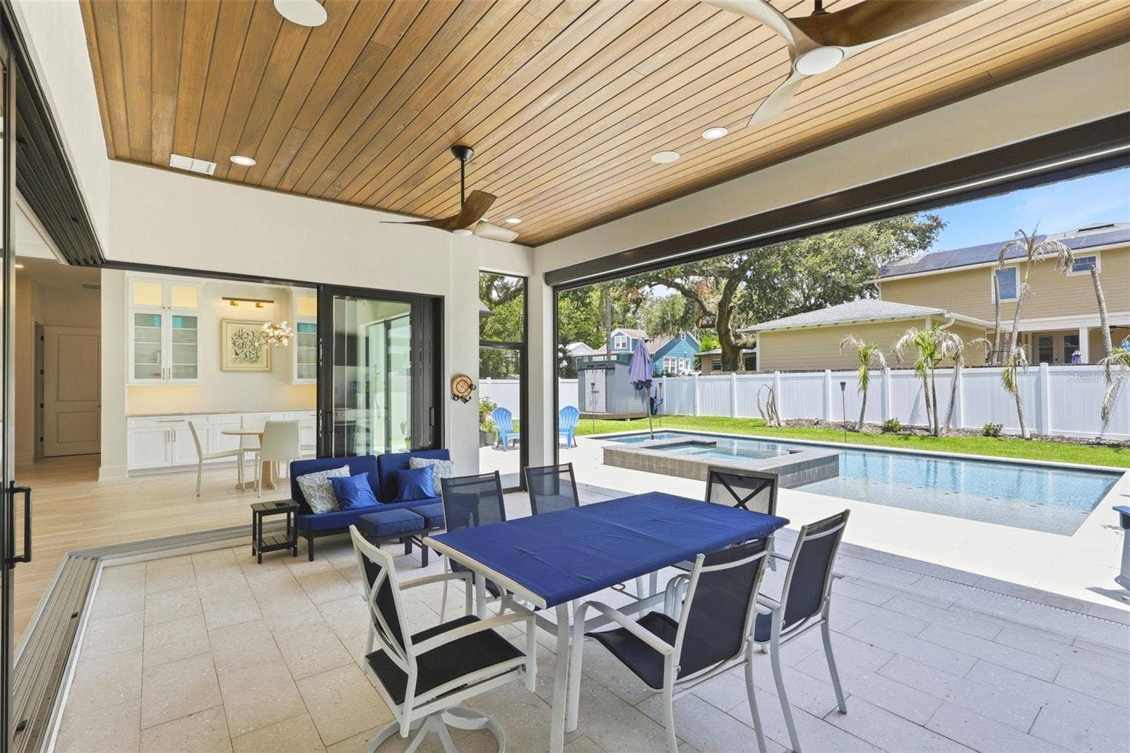 809 E CHURCH STREET, Orlando, FL 32801 Lanai area with doors open to the living area and retractable screen open to the pool