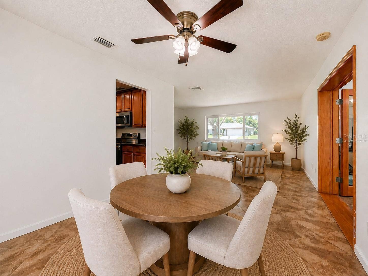 8654 ALEGRE CIRCLE, Orlando, FL 32836 Virtually Staged Dining Room and Living Room/Family Room View