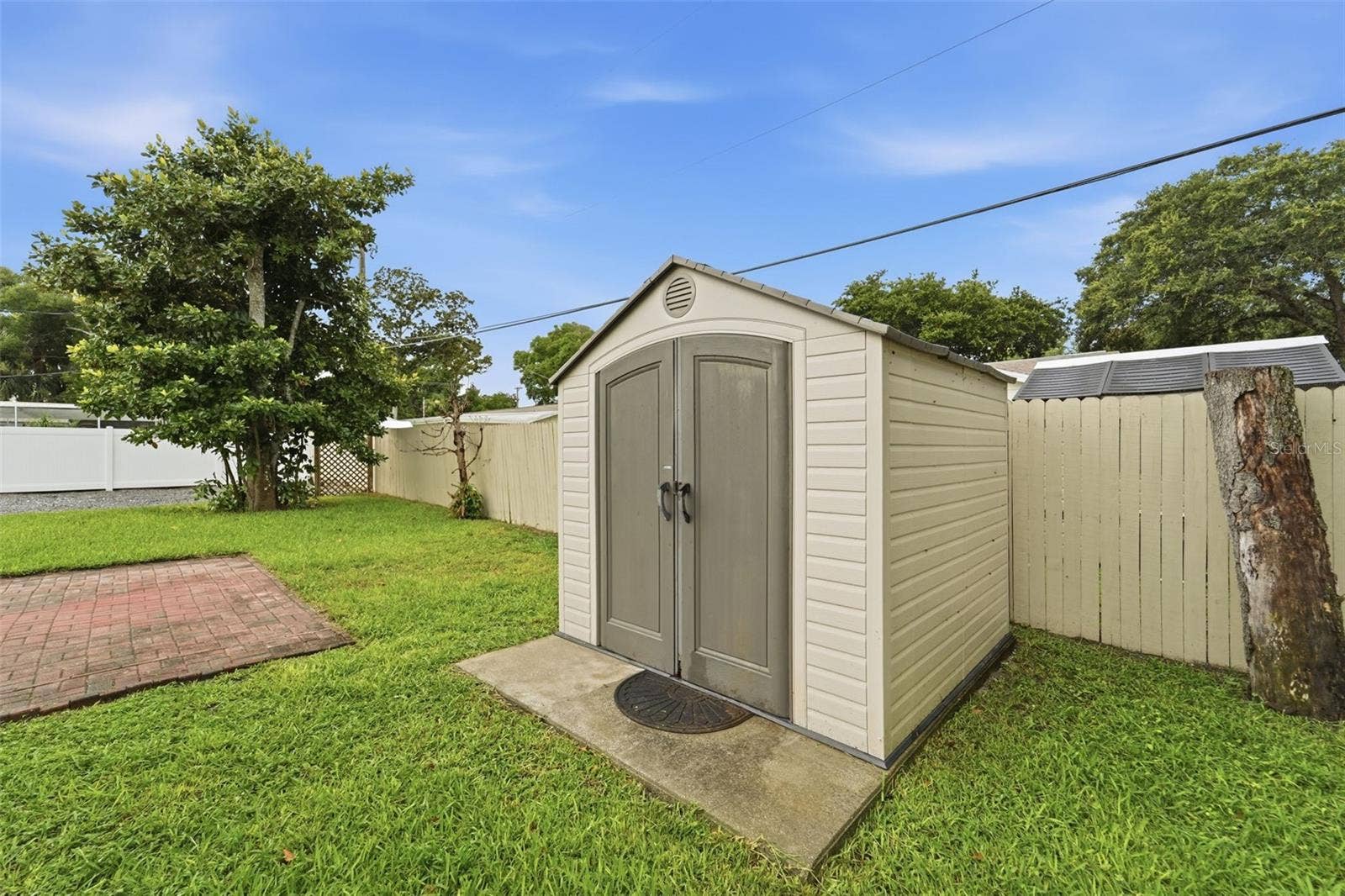 59 CRESTWOOD CIRCLE, Ormond Beach, FL 32174 Additional outdoor storage provides even more flexibility for tools and equipment.