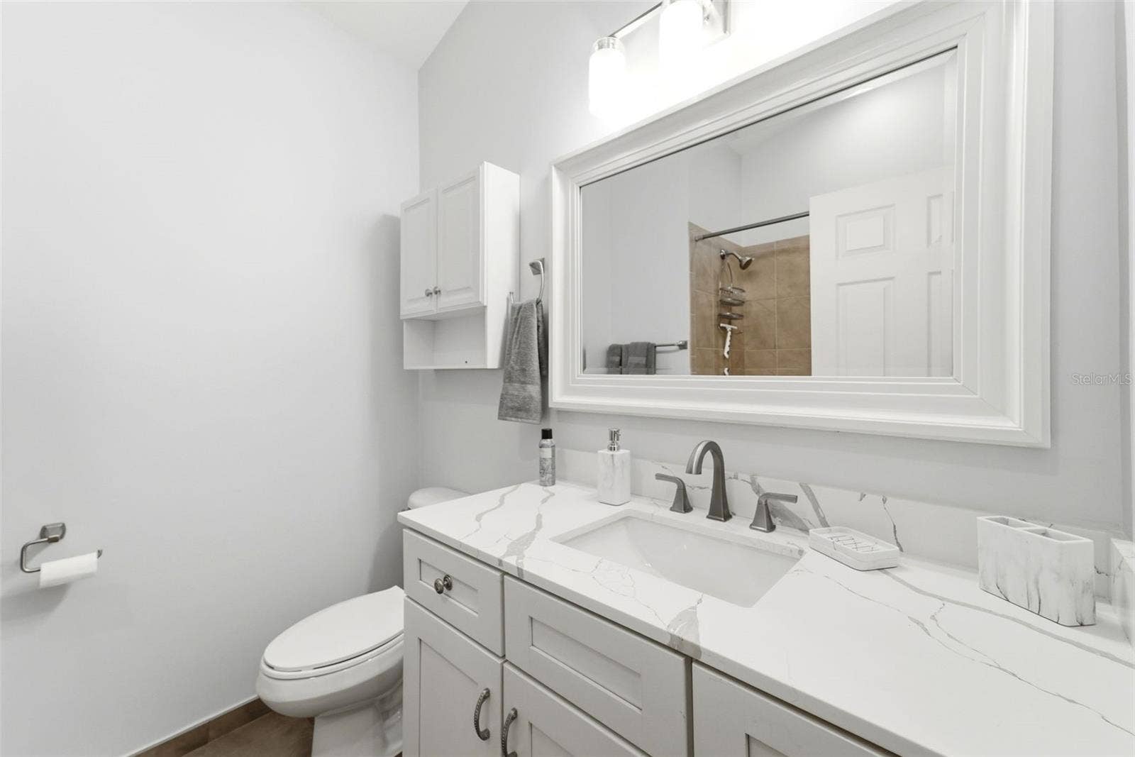 59 CRESTWOOD CIRCLE, Ormond Beach, FL 32174 Recently updated with quartz countertops, modern fixtures, and timeless finishes.