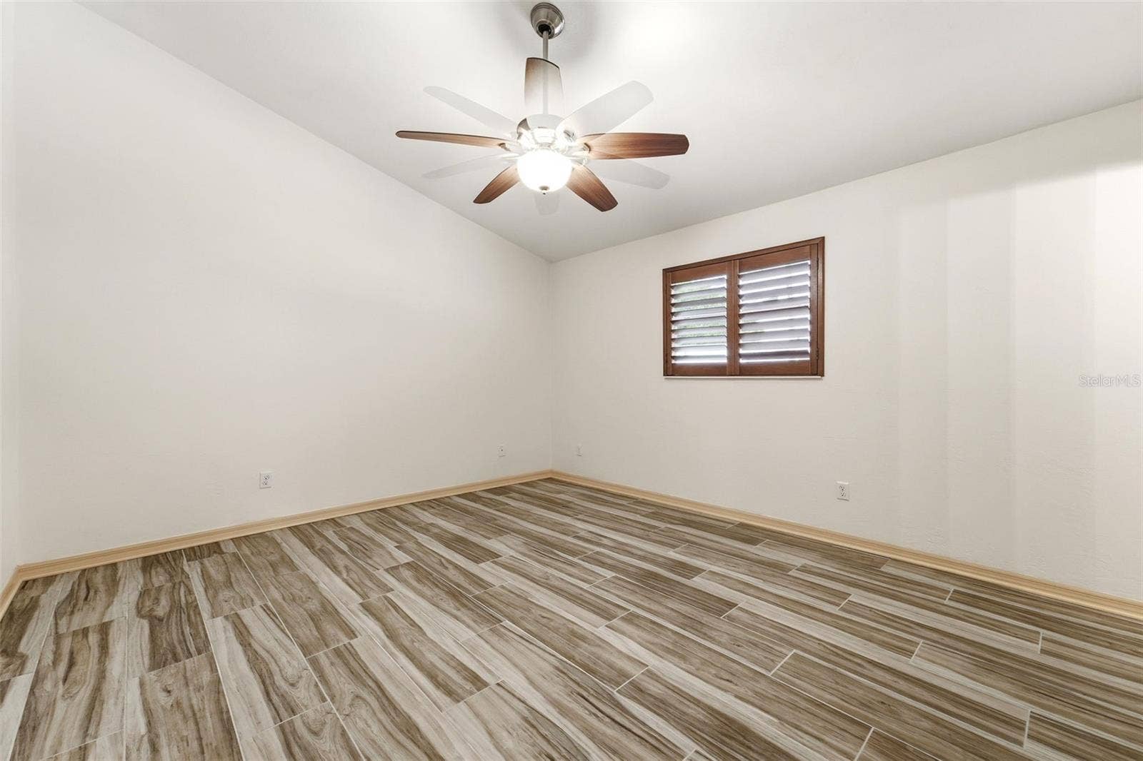 59 CRESTWOOD CIRCLE, Ormond Beach, FL 32174 Bedroom three with comfortable secondary bedroom with generous natural light.