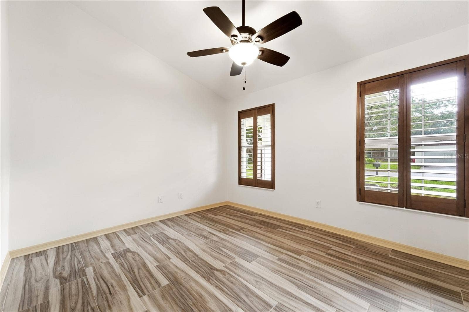 59 CRESTWOOD CIRCLE, Ormond Beach, FL 32174 Plantation shutters and vaulted ceilings add warmth and character throughout.