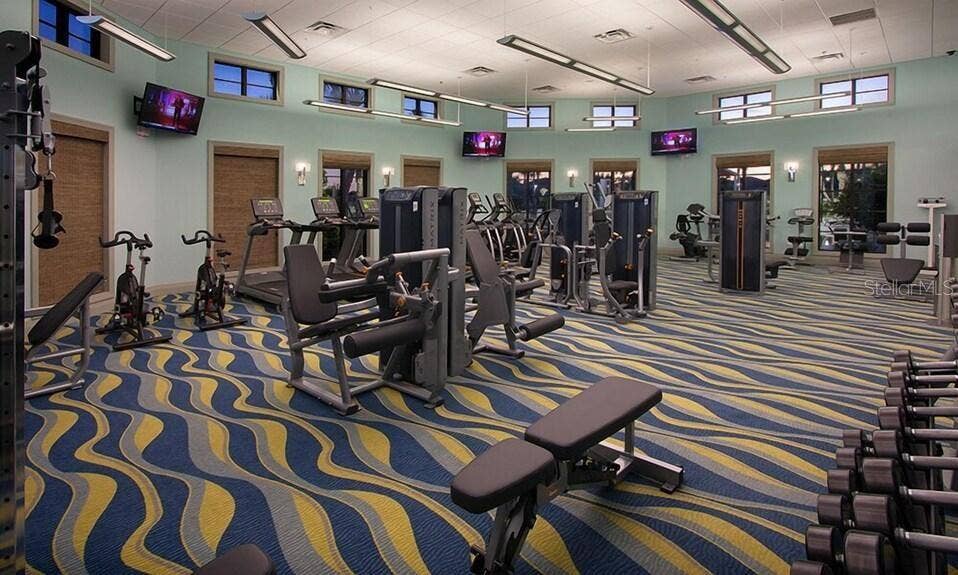 8813 BETH PAGE LANE, Davenport, FL 33896 Resort-style living at ChampionsGate! Enjoy incredible community amenities including resort pools, a lazy river, water slides, splash areas, clubhouse, fitness center, dining, sports courts and moreall designed to make every day feel like a vacation.