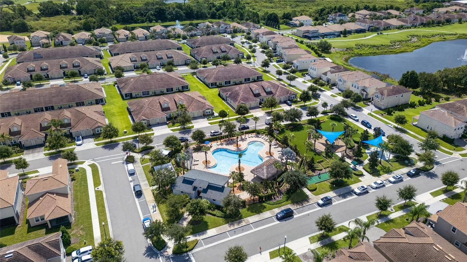 8813 BETH PAGE LANE, Davenport, FL 33896 Resort-style living at ChampionsGate! Enjoy incredible community amenities including resort pools, a lazy river, water slides, splash areas, clubhouse, fitness center, dining, sports courts and moreall designed to make every day feel like a vacation.