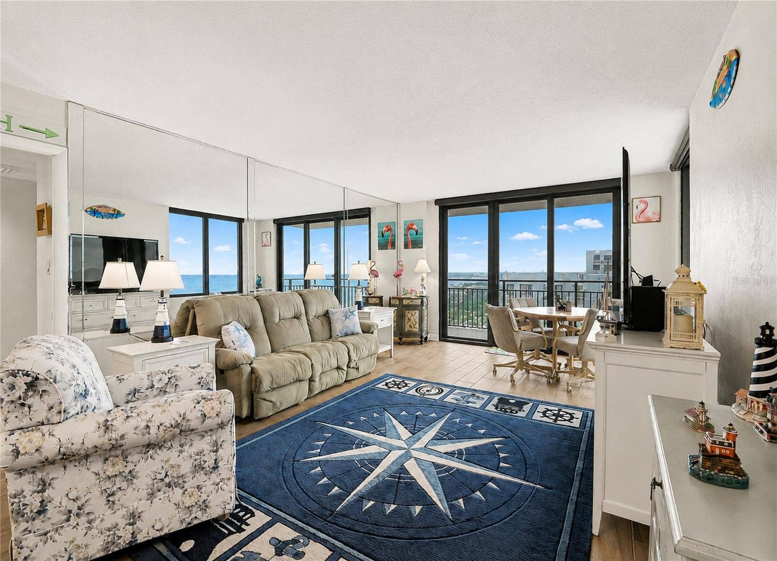 Living Room offering electric shades for privacy.