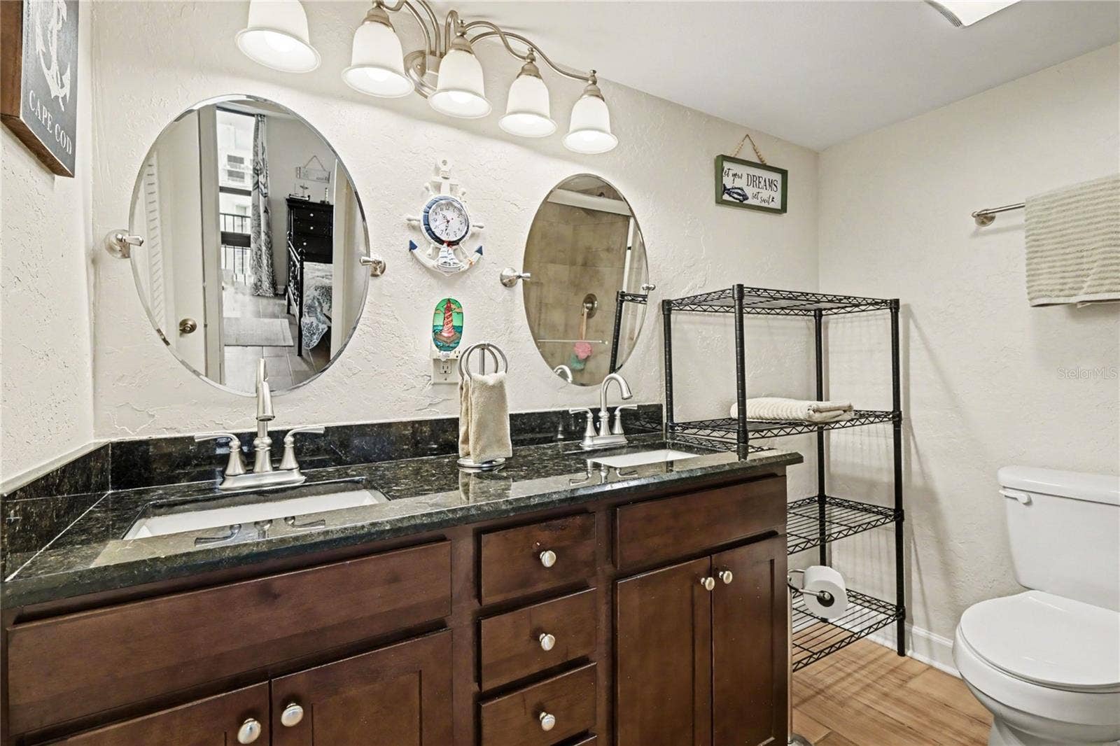 Primary bath with granite countertops and double vanites,