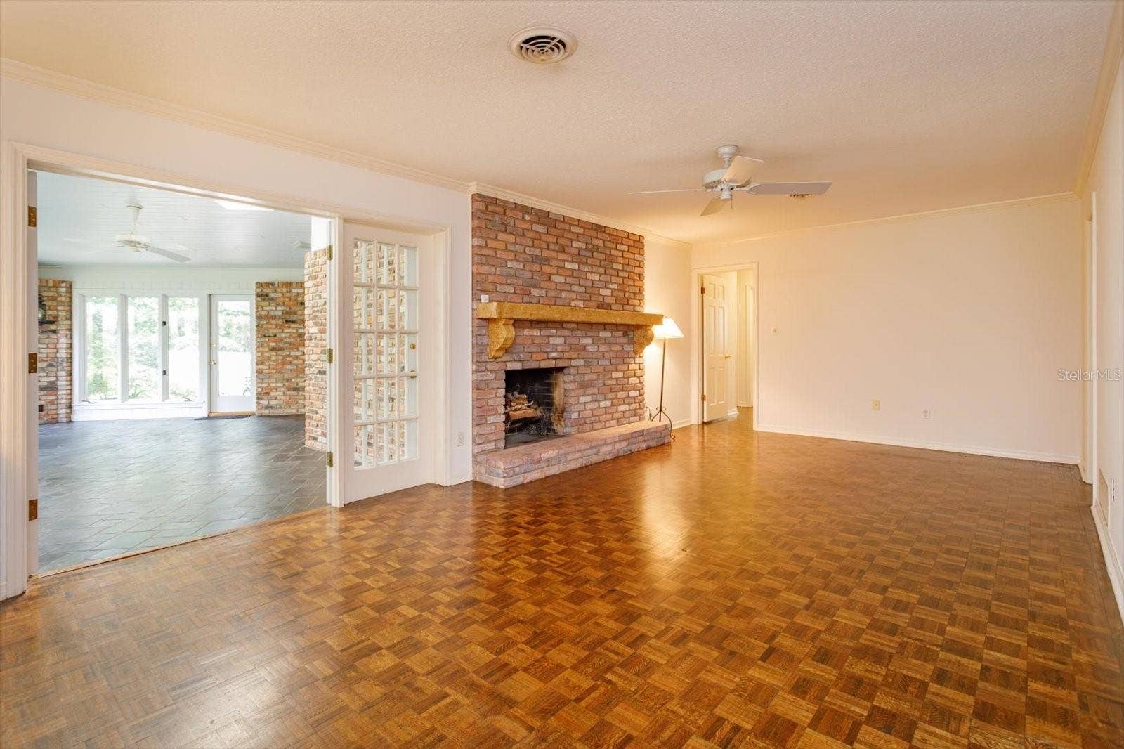 5019 GRAN LAC AVENUE, Orlando, FL 32812 Family Room with french doors to Florida Room