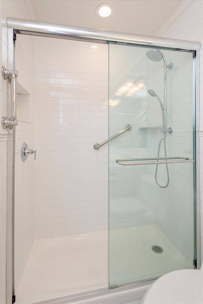 5019 GRAN LAC AVENUE, Orlando, FL 32812 Primary Bath updated step in shower, tile, glass door, faucet
