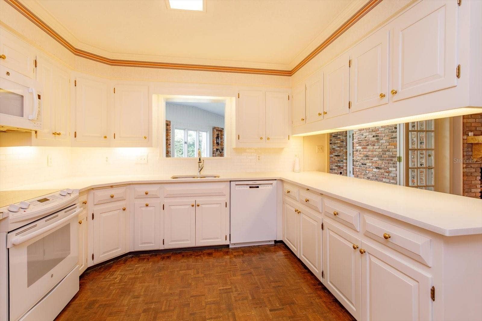 5019 GRAN LAC AVENUE, Orlando, FL 32812 Kitchen has lots of custom cabinet storage