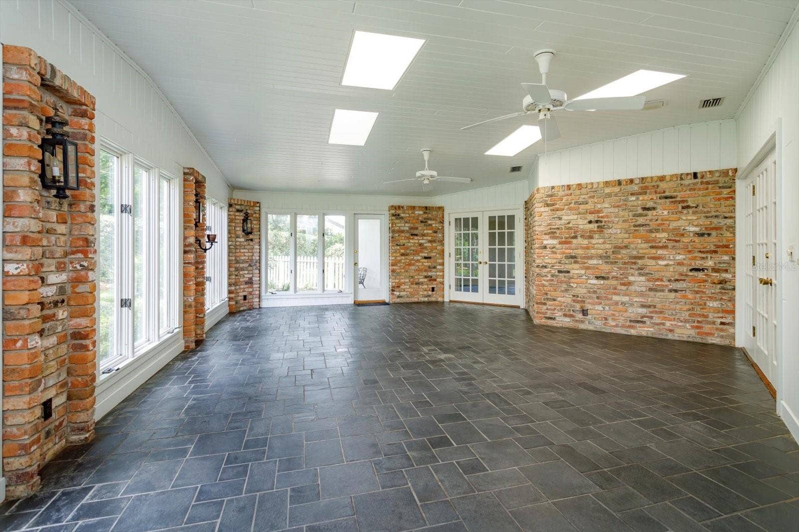 5019 GRAN LAC AVENUE, Orlando, FL 32812 Florida Room has door to yard and open to Kitchen, Family and Breakfast rooms
