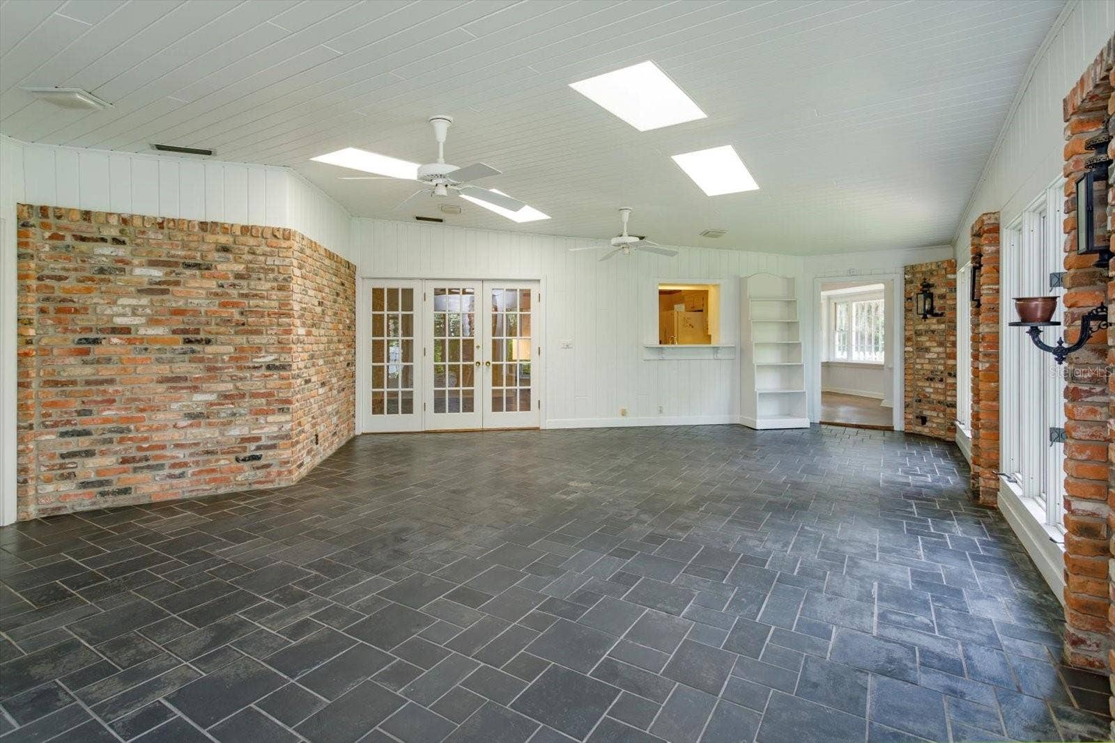 5019 GRAN LAC AVENUE, Orlando, FL 32812 Florida Room has french doors to family room