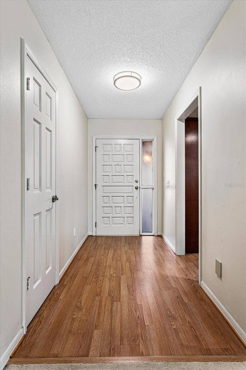179 GOLF CLUB DRIVE, Longwood, FL 32779 Foyer with coat closet, opens to kitchen and great room