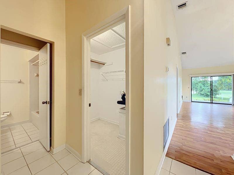 340 GOLFSIDE COVE, #340, Longwood, FL 32779 Foyer Showing Guest Bath, Inside Storage & Golf Course View