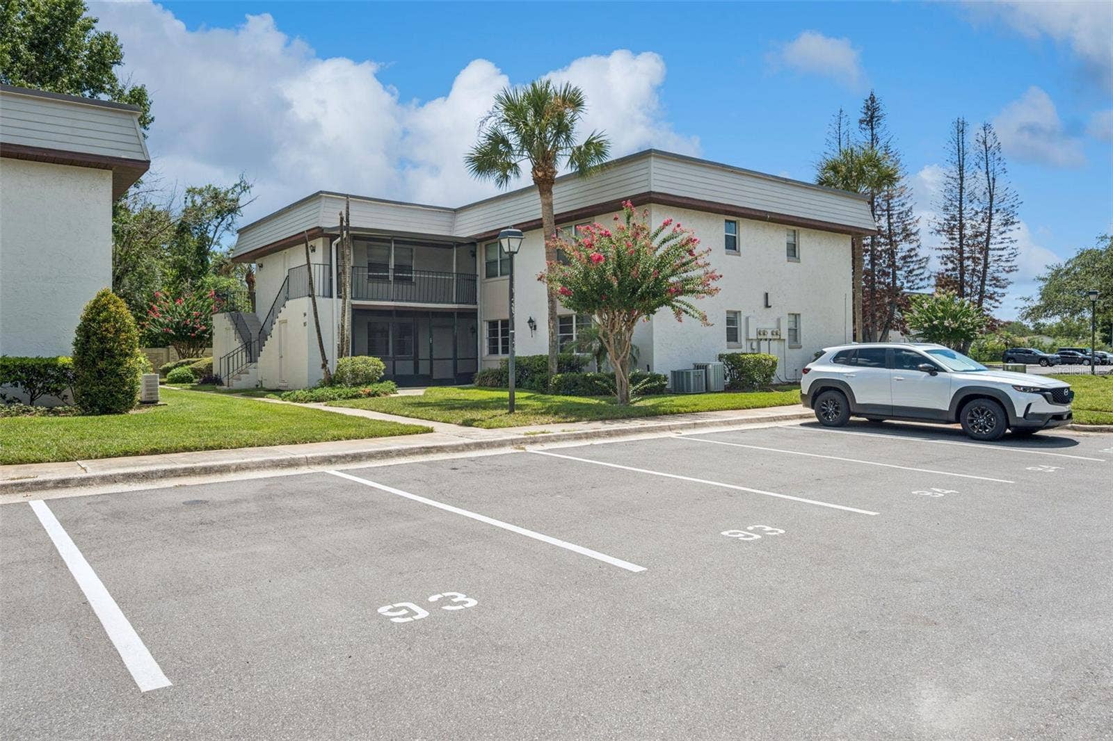 93 WINDTREE LANE, #102, Winter Garden, FL 34787 Two designated parking spots