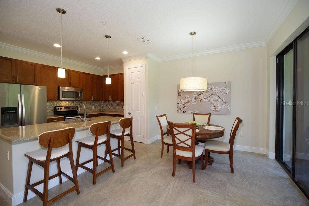 1541 CORKERY COURT, #1541, Winter Springs, FL 32708 DINING ROOM AND KITCHEN VIEWS