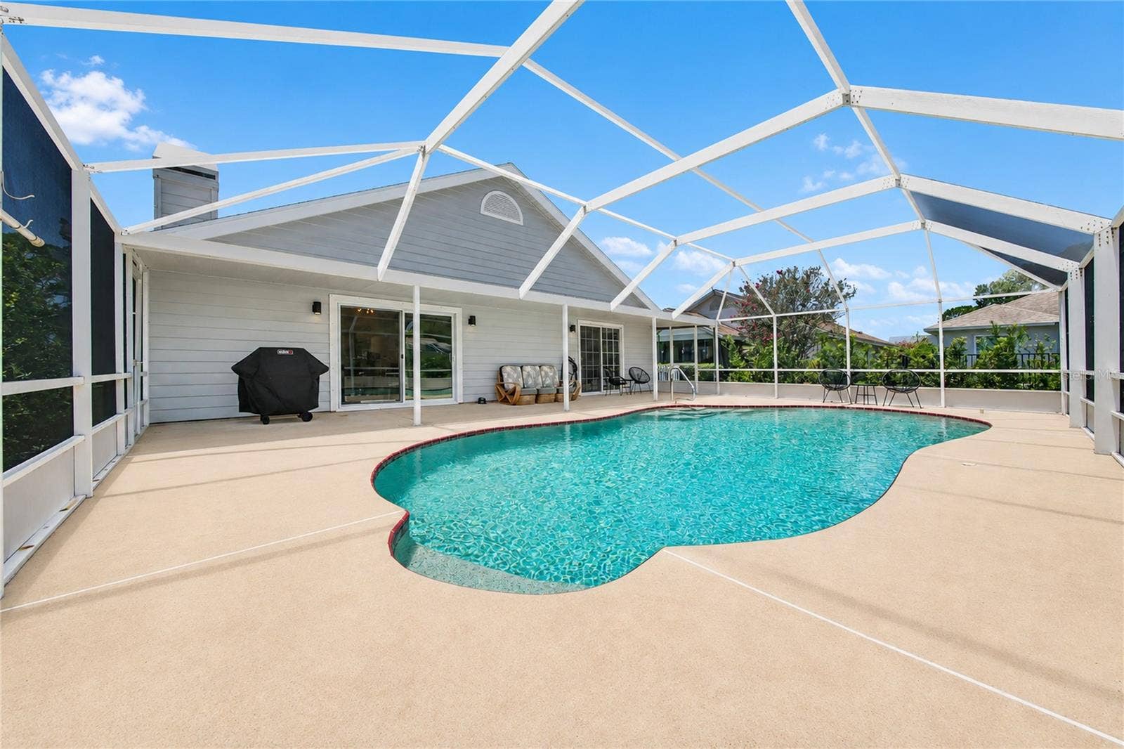 2013 BEAVER CREEK DRIVE, Port Orange, FL 32128 Enjoy the in-ground pool, spacious surrounding deck, and the 40-by-8-foot covered porchperfect for relaxing and entertaining outdoors.