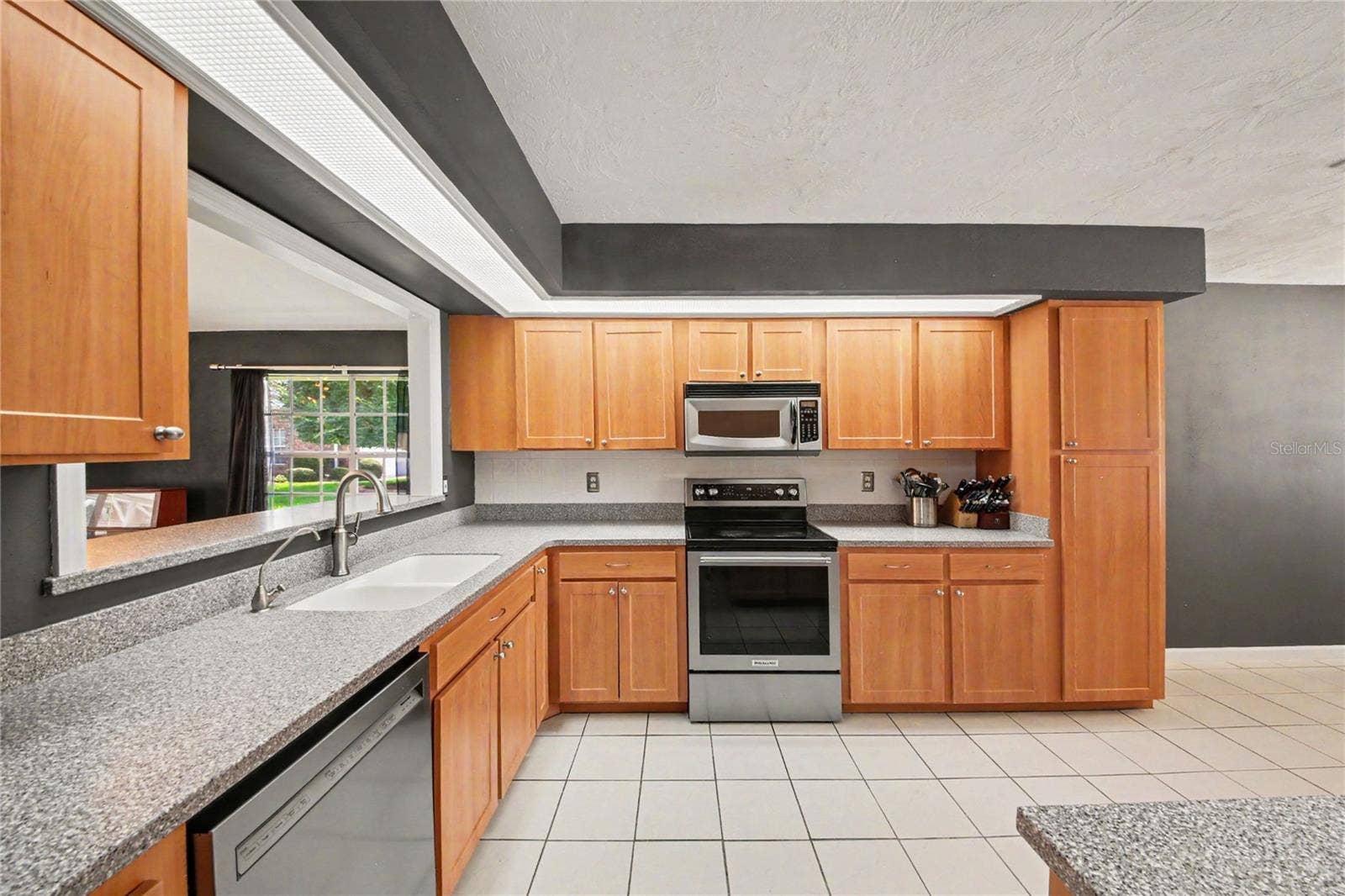 2013 BEAVER CREEK DRIVE, Port Orange, FL 32128 A convenient kitchen pass-through opens to the great room, creating a more connected and inviting living space.