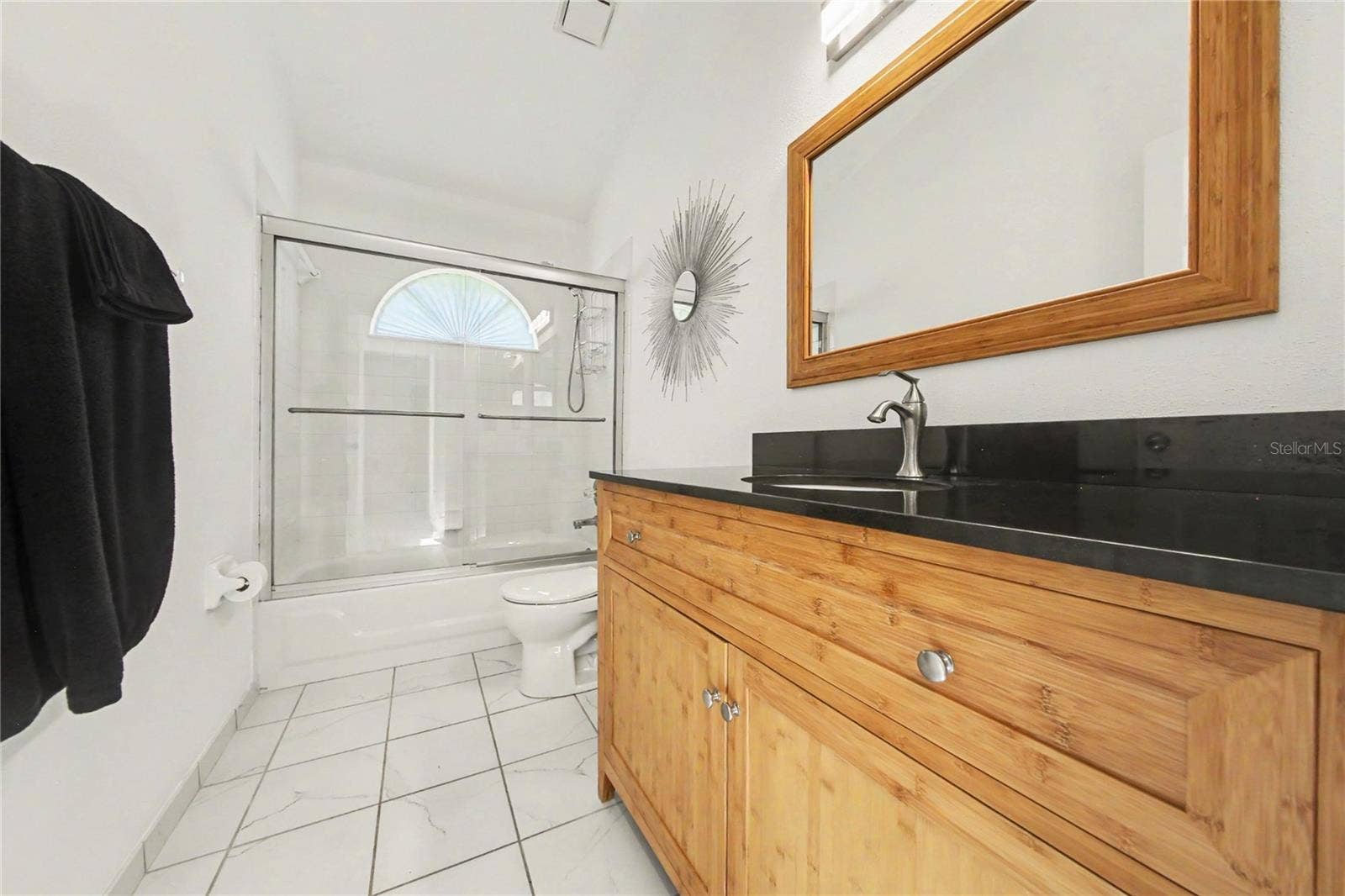 2013 BEAVER CREEK DRIVE, Port Orange, FL 32128 The guest bath features a tub-and-shower combination and an updated vanity.