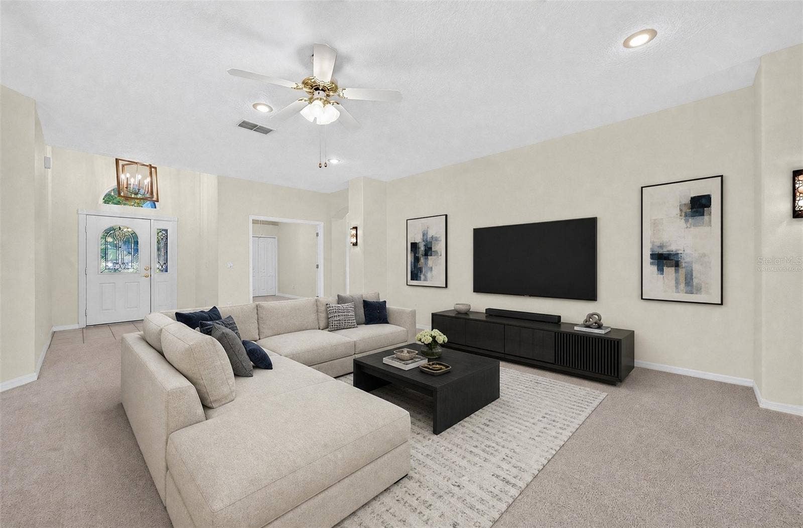 The Living Room offers a COMFORTABLE SPACE for quiet evenings at home or gathering with family and friends. Virtually Staged