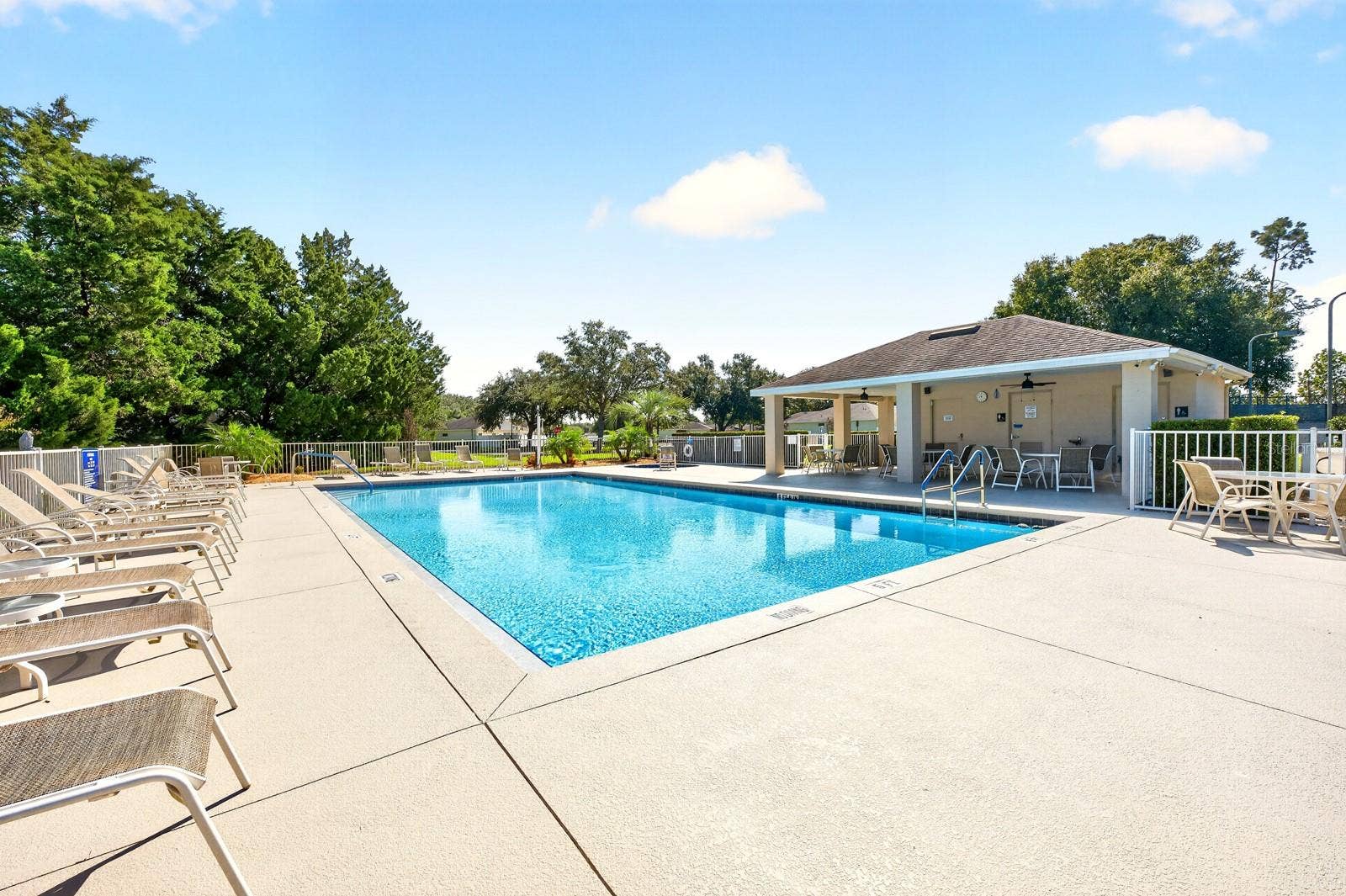 Located within a 24-HOUR GUARD-GATED COMMUNITY, the home offers a PEACEFUL SETTING along with amenities that make it easy to stay active, connect with neighbors and enjoy the Florida lifestyle.