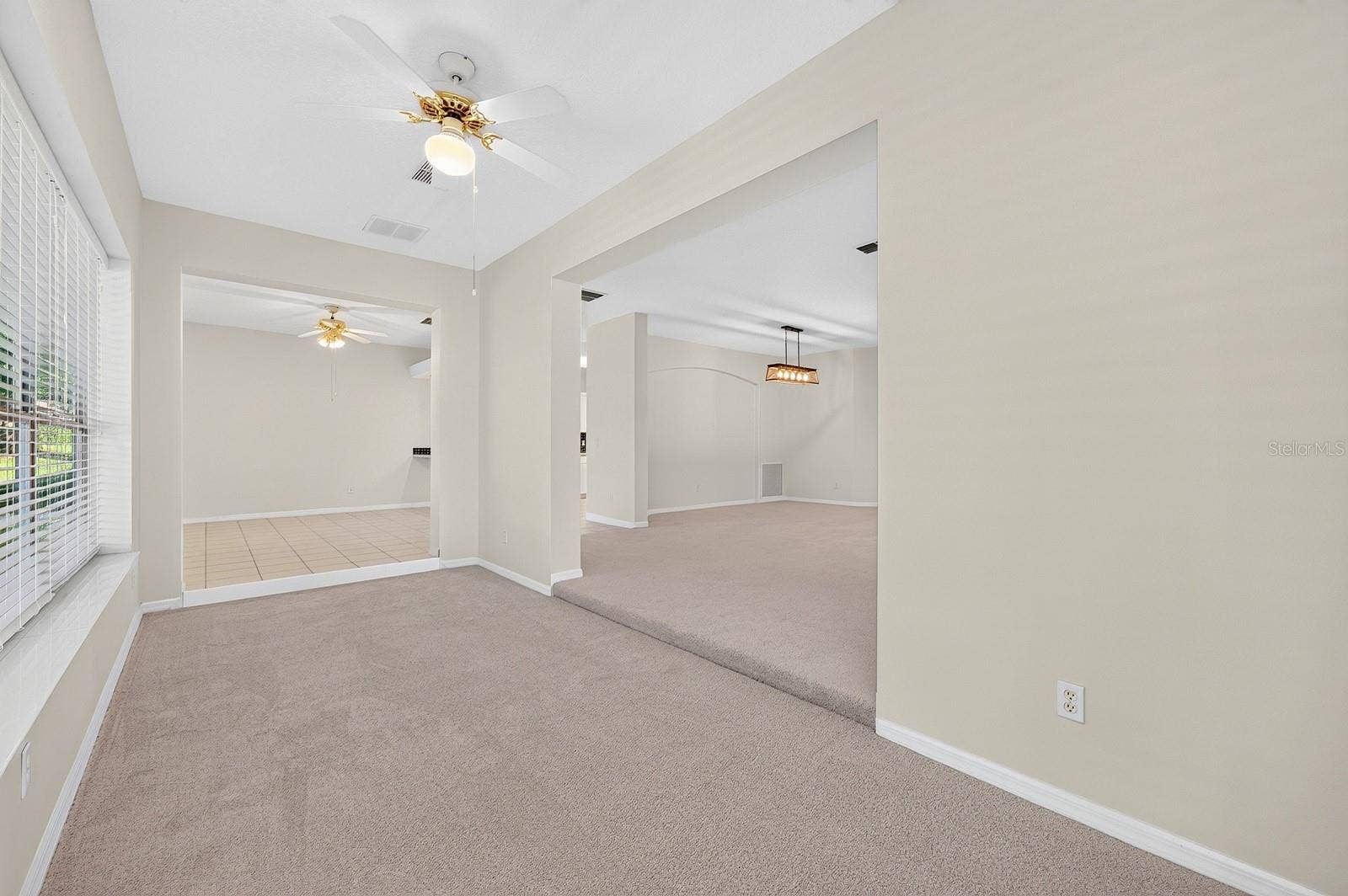 Just off the Living Room, a BONUS SUNROOM offers a bright and relaxing retreat overlooking the BACKYARD PATIO AND LANAI.