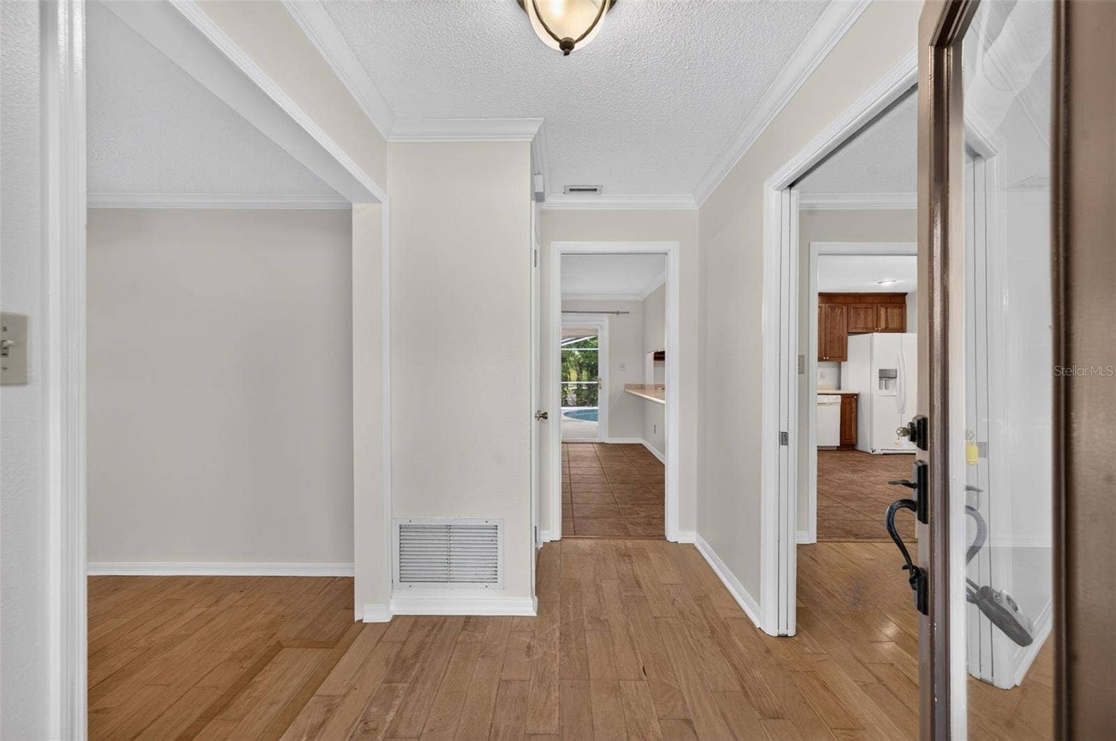 2051 DYAN WAY, Maitland, FL 32751 Foyer with living room on left and dining room on the right