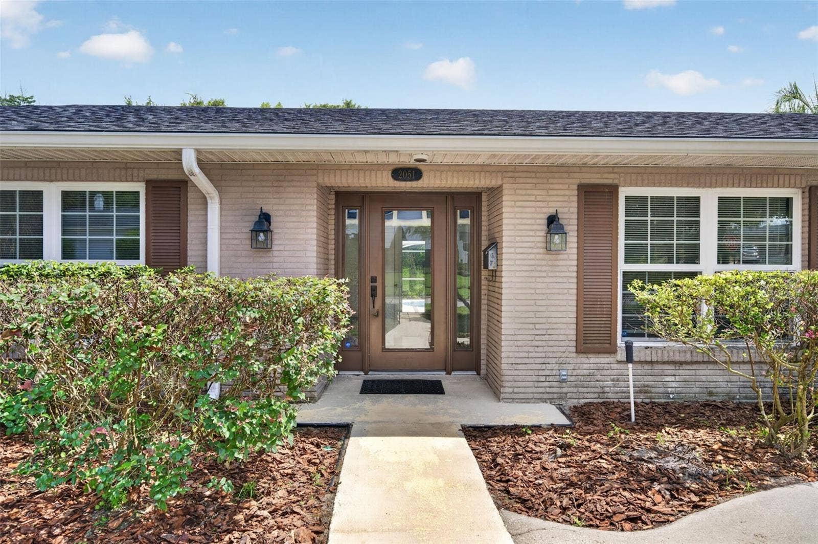 2051 DYAN WAY, Maitland, FL 32751 Landscape refresh and pressure washing make a difference