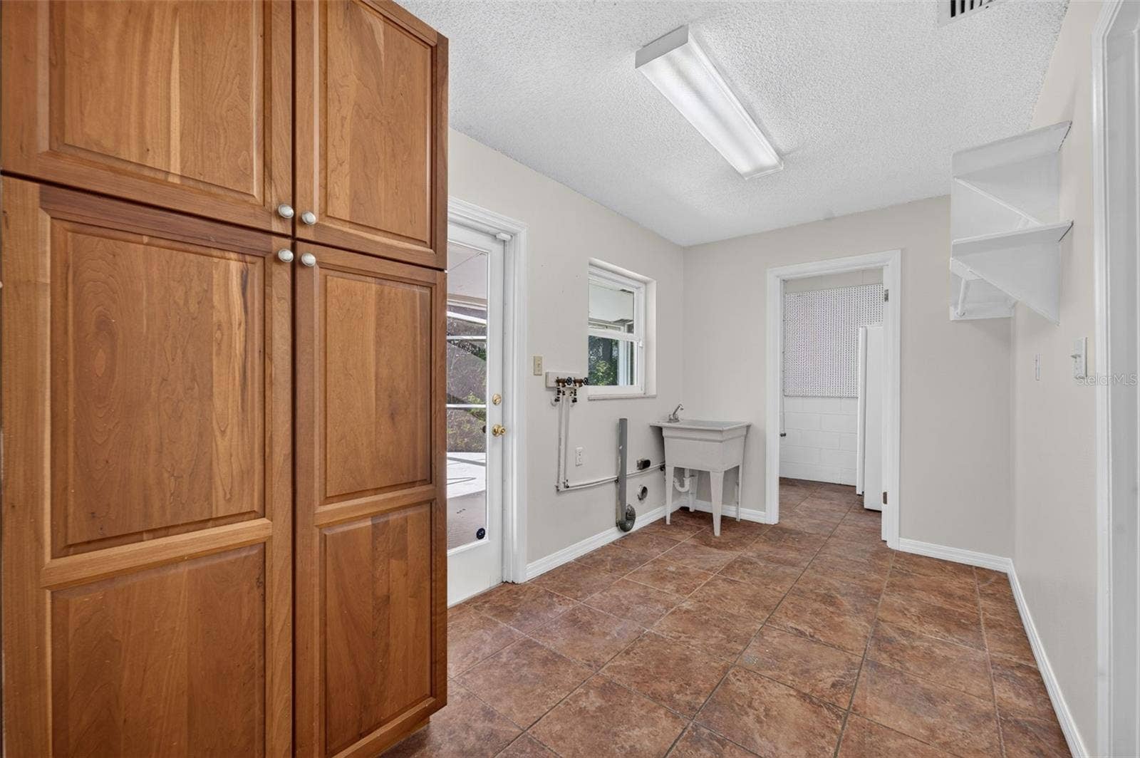 2051 DYAN WAY, Maitland, FL 32751 Inside laundry with storage