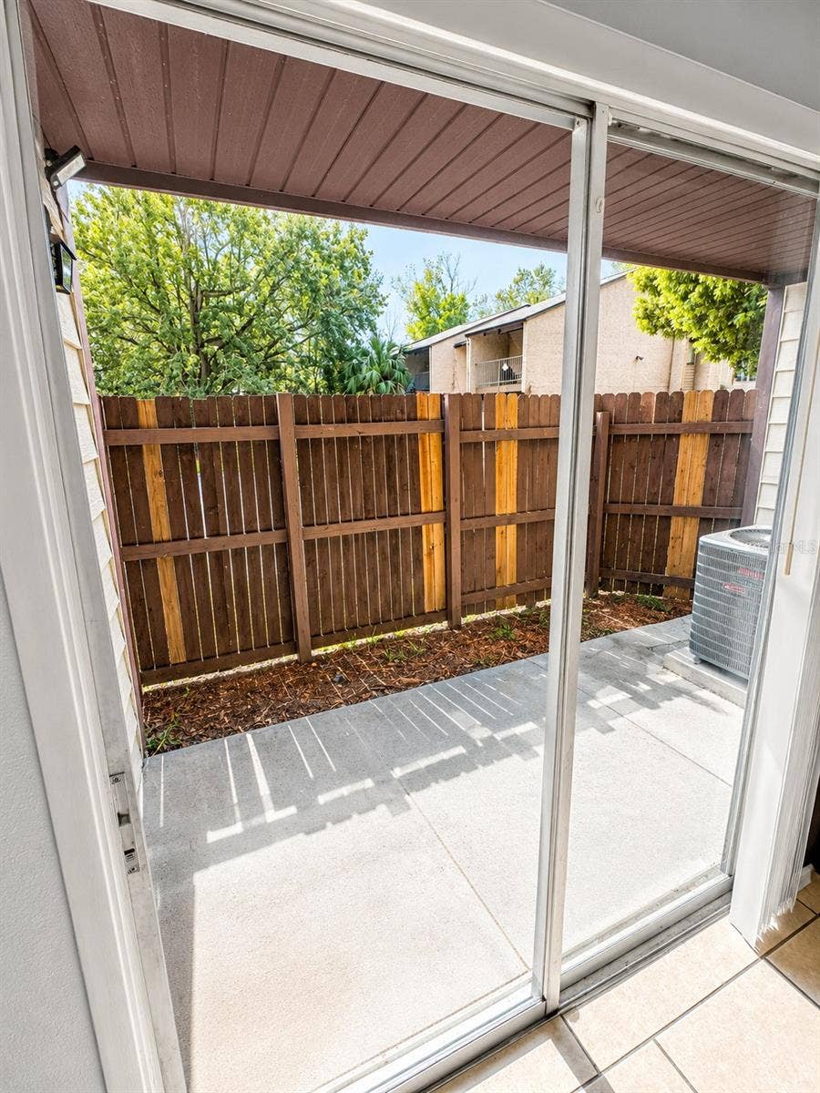 4001 WOODFERN DRIVE, #C1, Orlando, FL 32839 Fenced in back porch