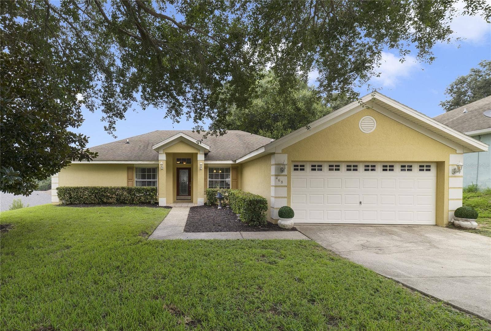468 SHADY CREEK LANE, Clermont, FL 34711 Nestled on more than a QUARTER OF AN ACRE in the welcoming community of East Lake Estates, this BEAUTIFULLY MAINTAINED 3-bedroom, 2-bath home offers the perfect blend of comfort, style, and outdoor living.
