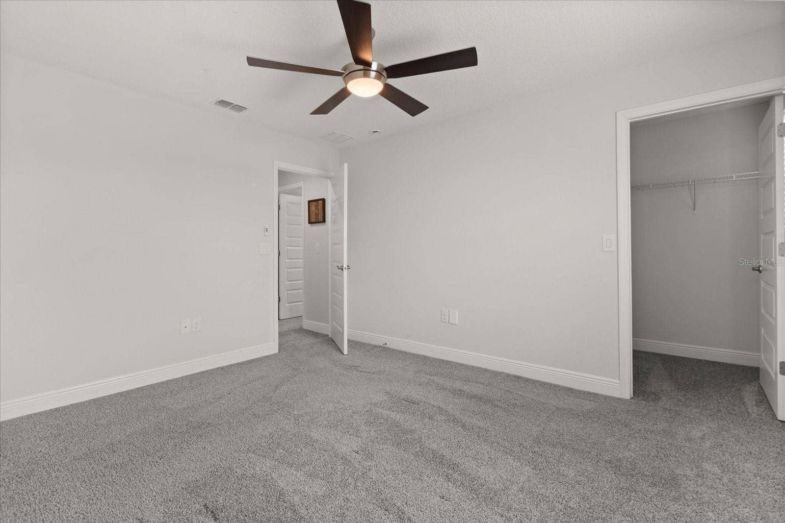 16124 AZURE KEY STREET, Winter Garden, FL 34787 Upstairs bedroom 2with walk in closet and in-suite bathroom