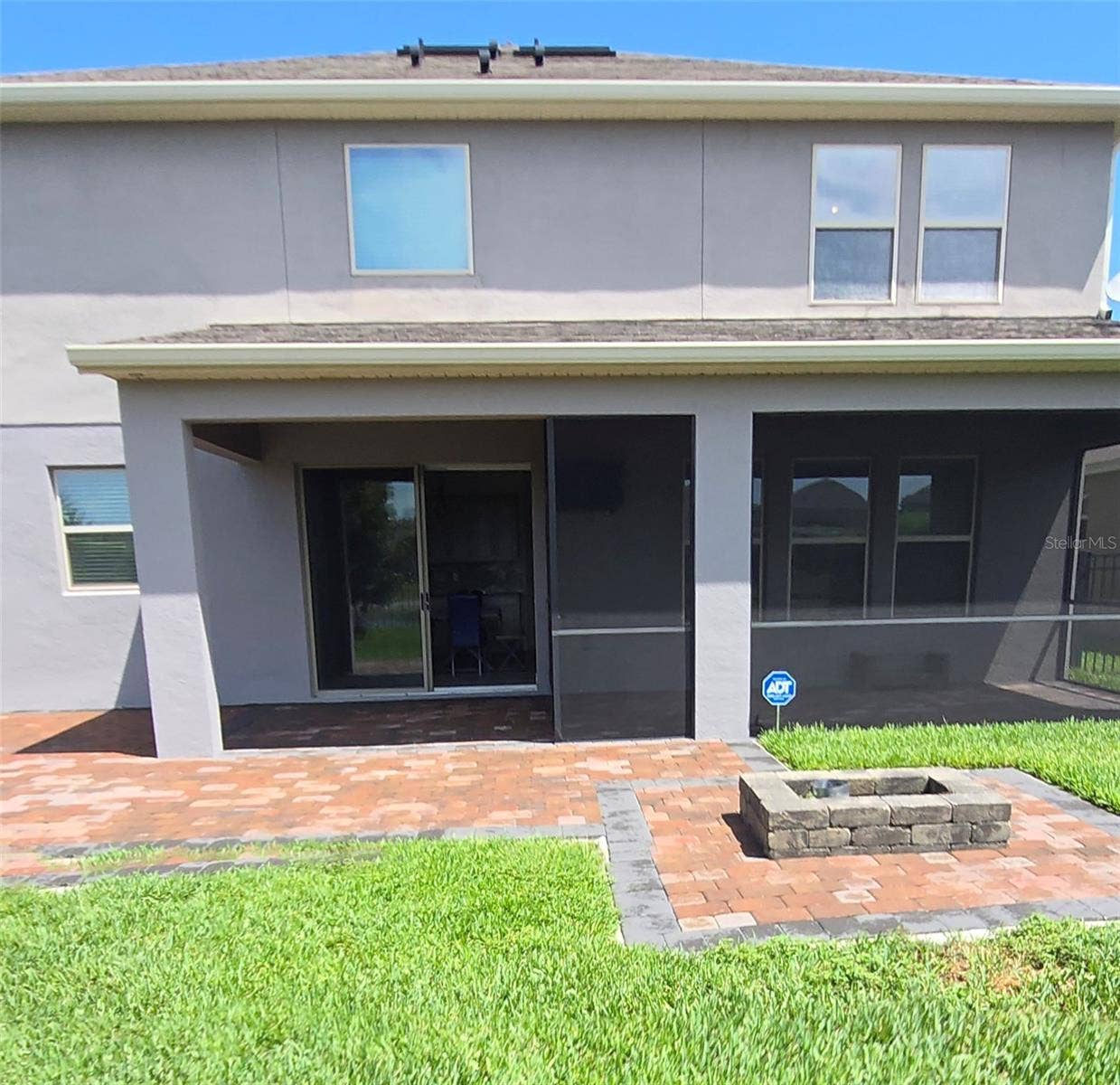 16124 AZURE KEY STREET, Winter Garden, FL 34787 Back covered porch and screened in porch with TV