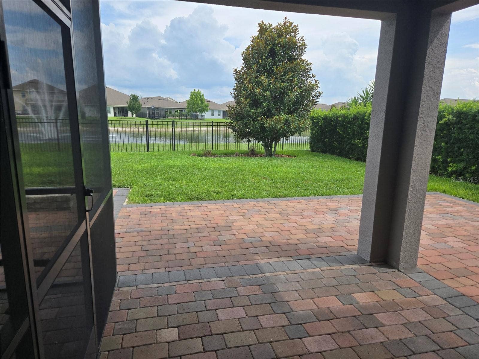 16124 AZURE KEY STREET, Winter Garden, FL 34787 covered back porch with screened in porch to left
