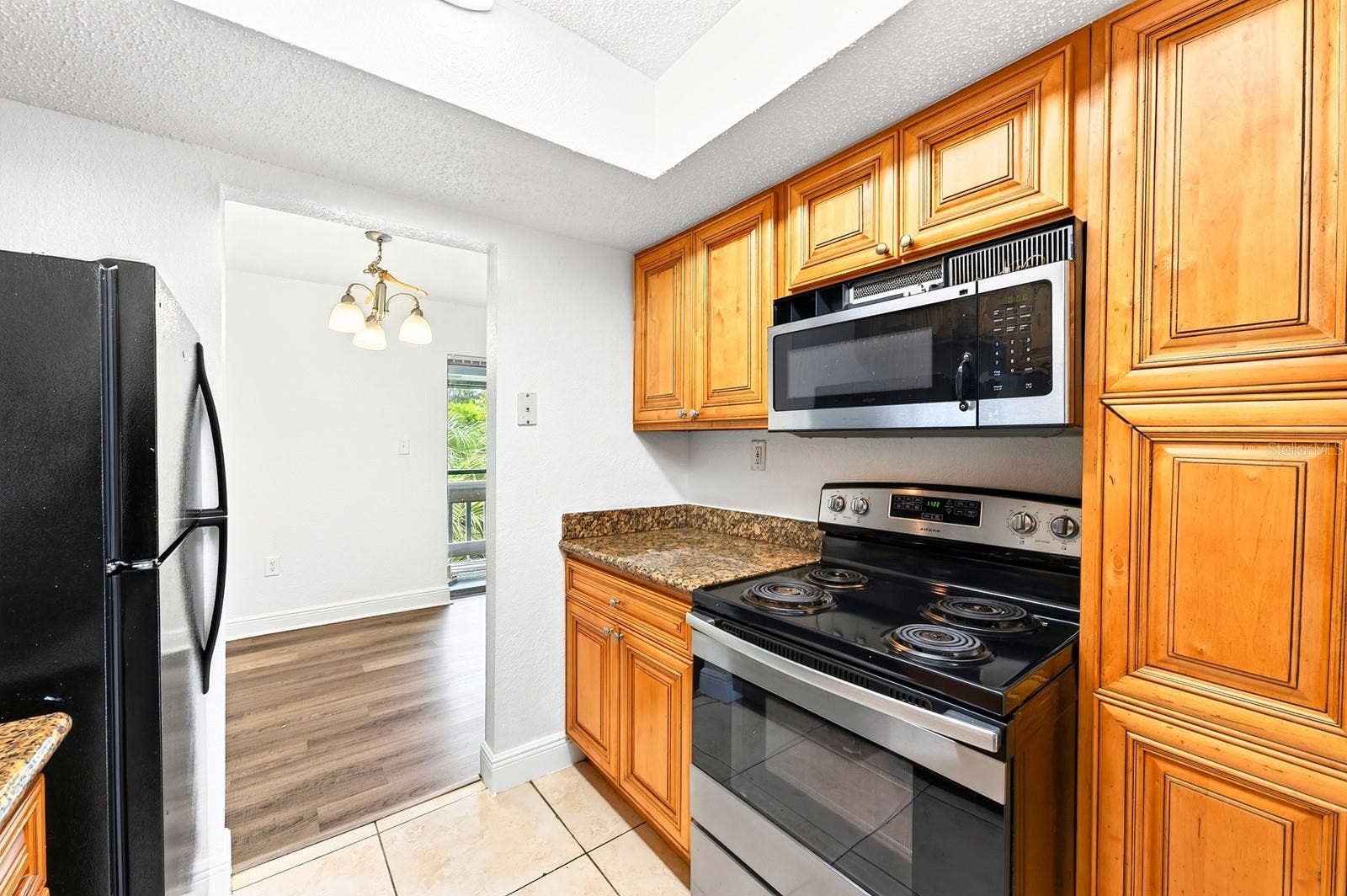 4737 S TEXAS AVENUE, #4737D, Orlando, FL 32839 Kitchen connects to the dining room
