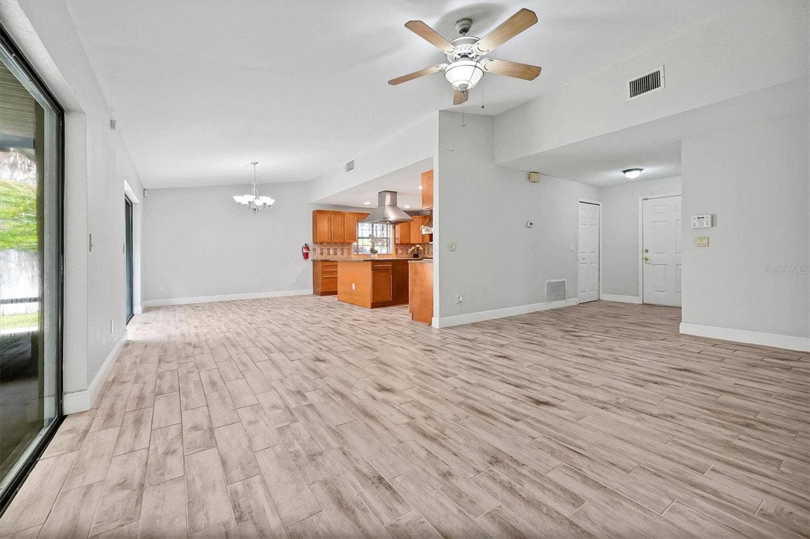 8405 WAIALAE COURT, Orlando, FL 32819 Dining room & kitchen & living room space