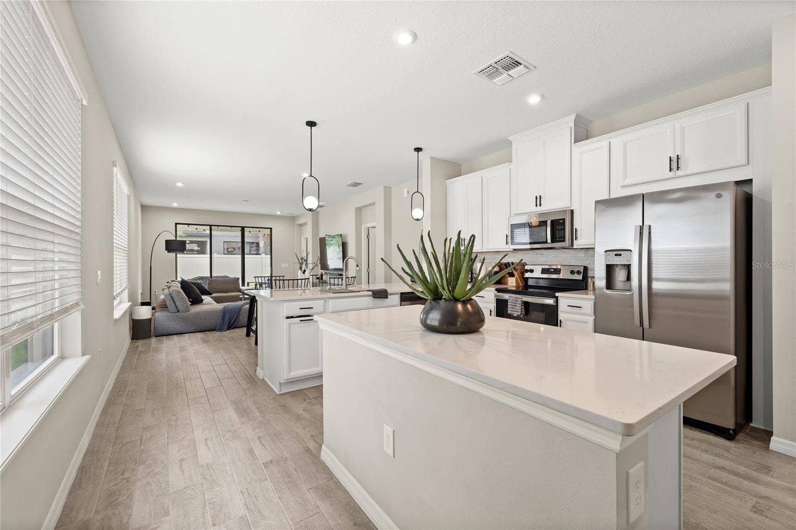 1122 WILDMEADOW RUN, Winter Park, FL 32792 Kitchen + Dining + Living Room