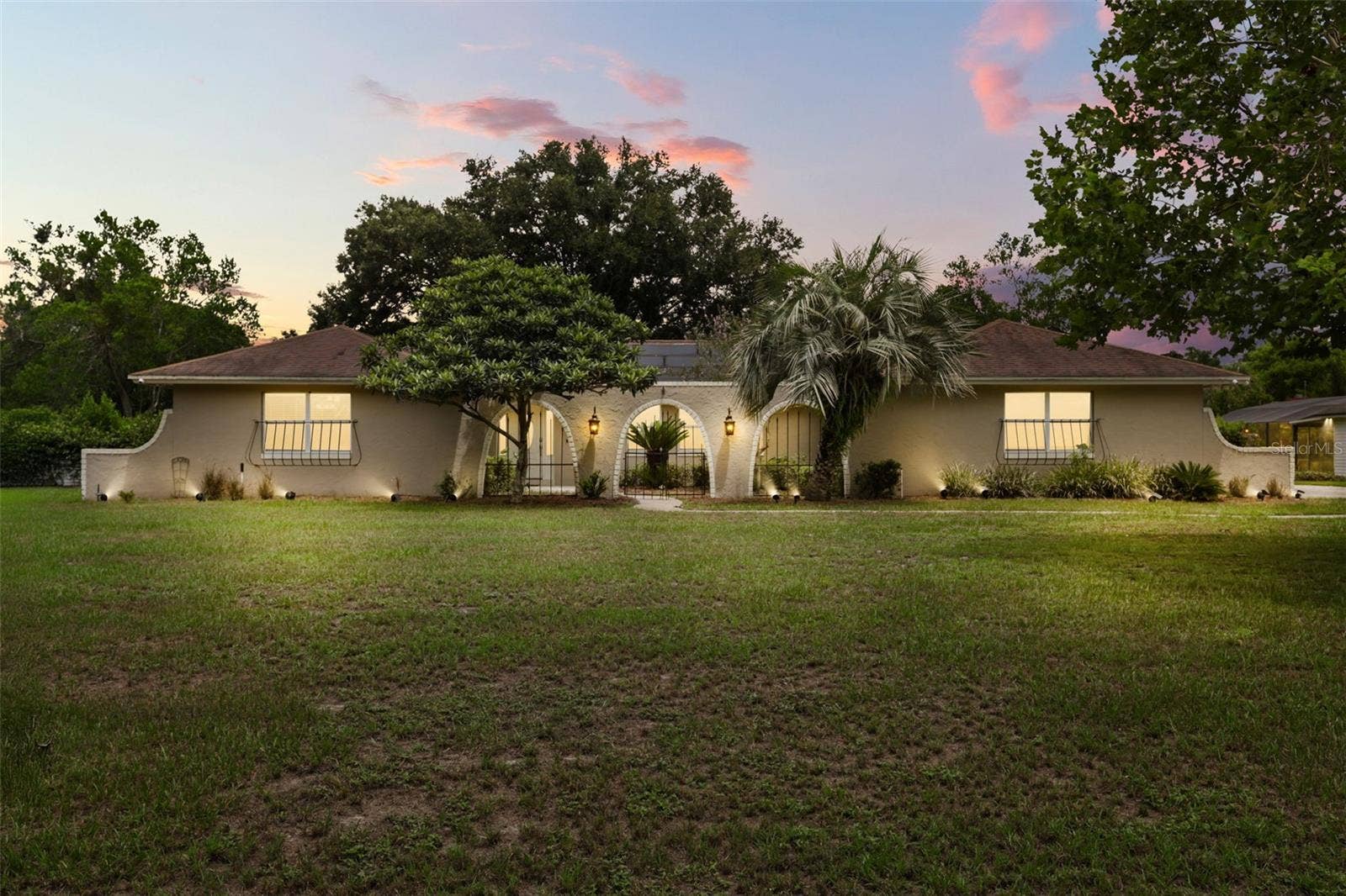 110 LONGHORN ROAD, Winter Park, FL 32792 Nestled on an OVERSIZED HOMESITE of well over half an acre in the sought-after Lake Ann Estates of Winter Park.