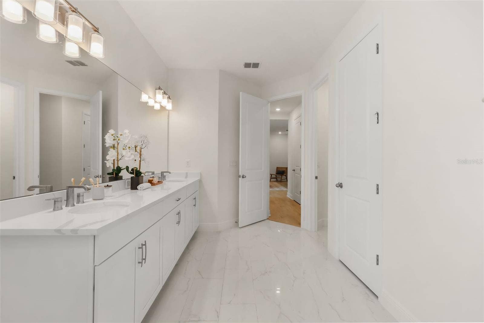 14360 CREST PALM AVENUE, Windermere, FL 34786 Luxurious primary bathroom with shower, dual vanity, soaker tub, and water closet