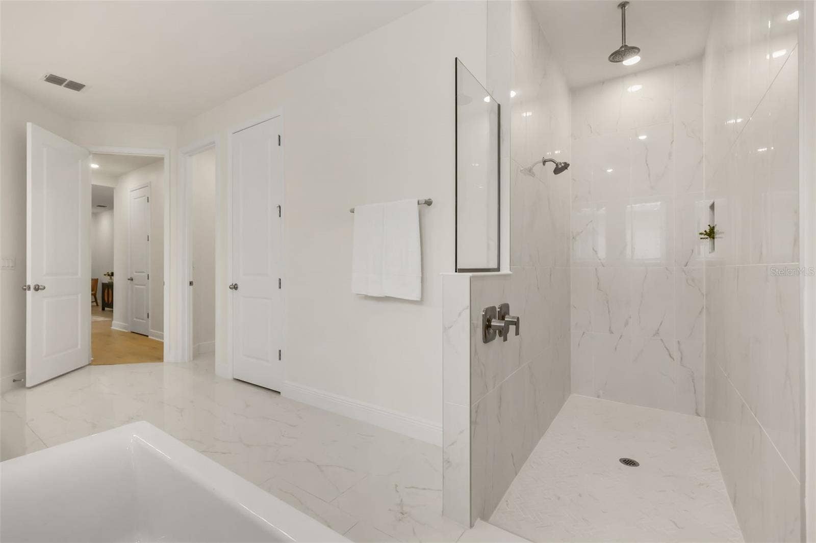 14360 CREST PALM AVENUE, Windermere, FL 34786 Luxurious primary bathroom with shower, dual vanity, soaker tub, and water closet