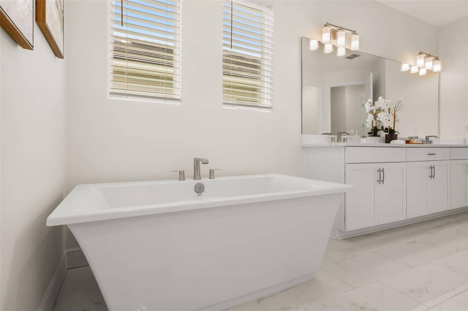 14360 CREST PALM AVENUE, Windermere, FL 34786 Luxurious primary bathroom with shower, dual vanity, soaker tub, and water closet