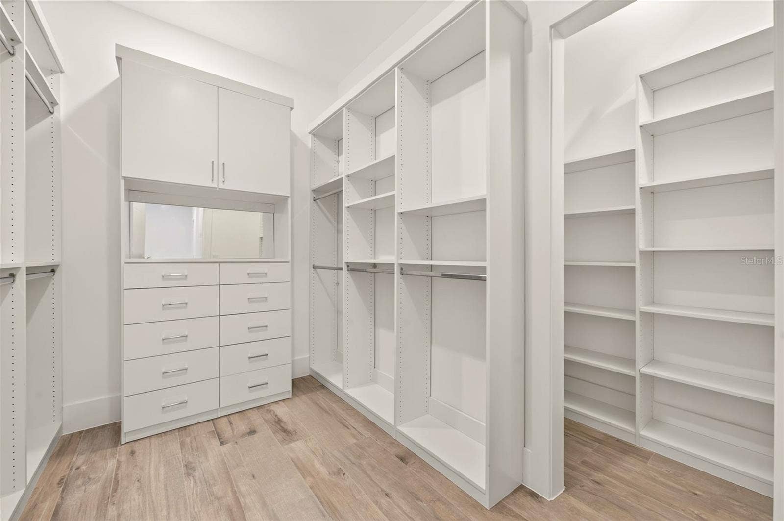 Primary bedroom walk-in closet