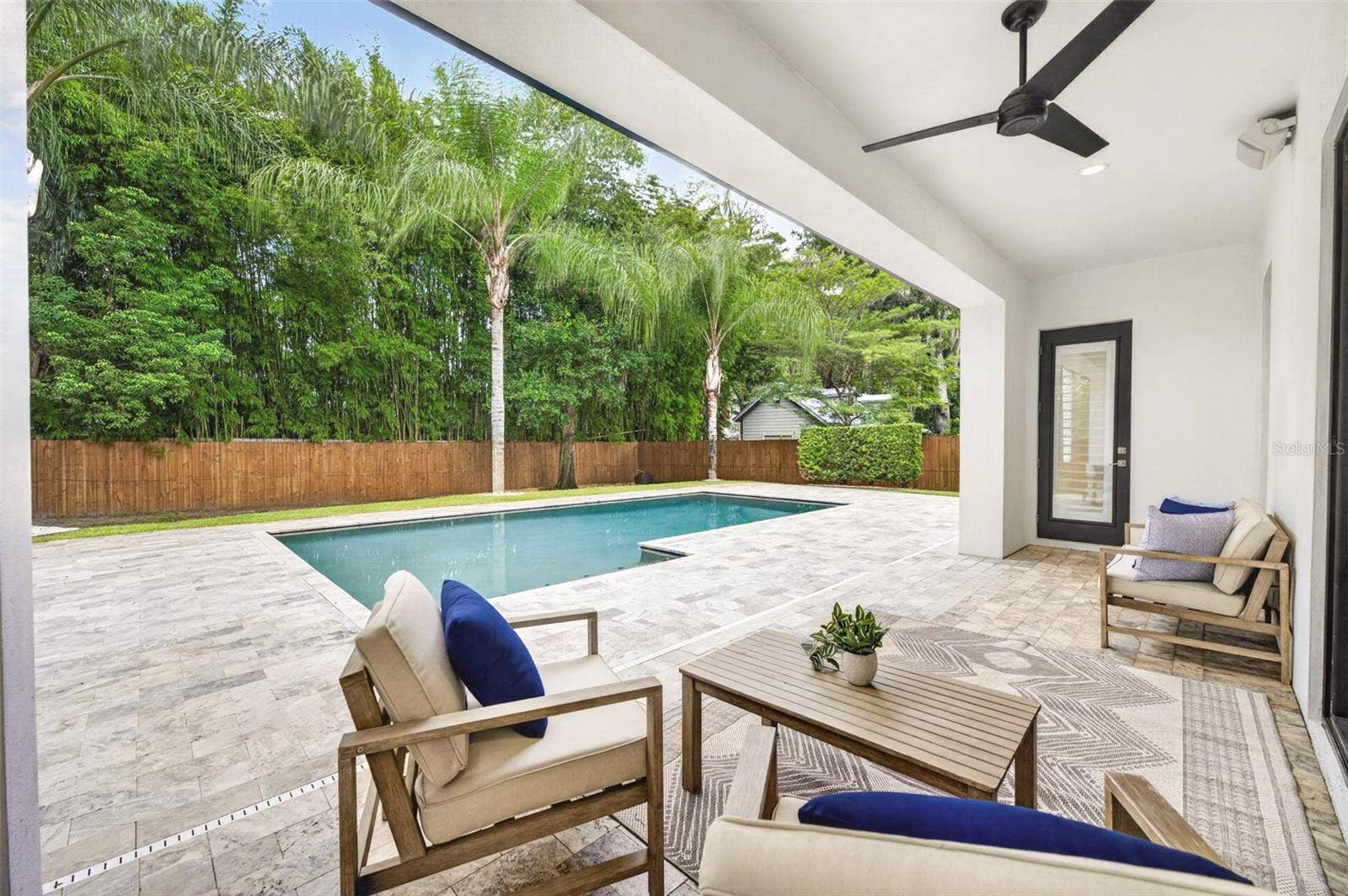 Rear lanai overlooking the private backyard/pool