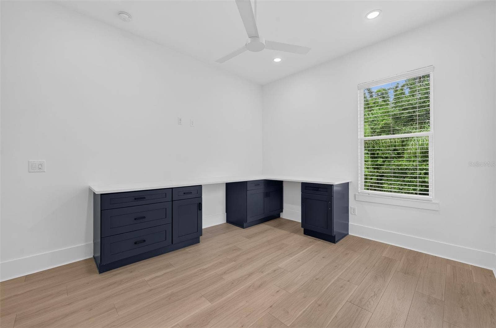Bedroom 3 with custom workstation & walk-in closet